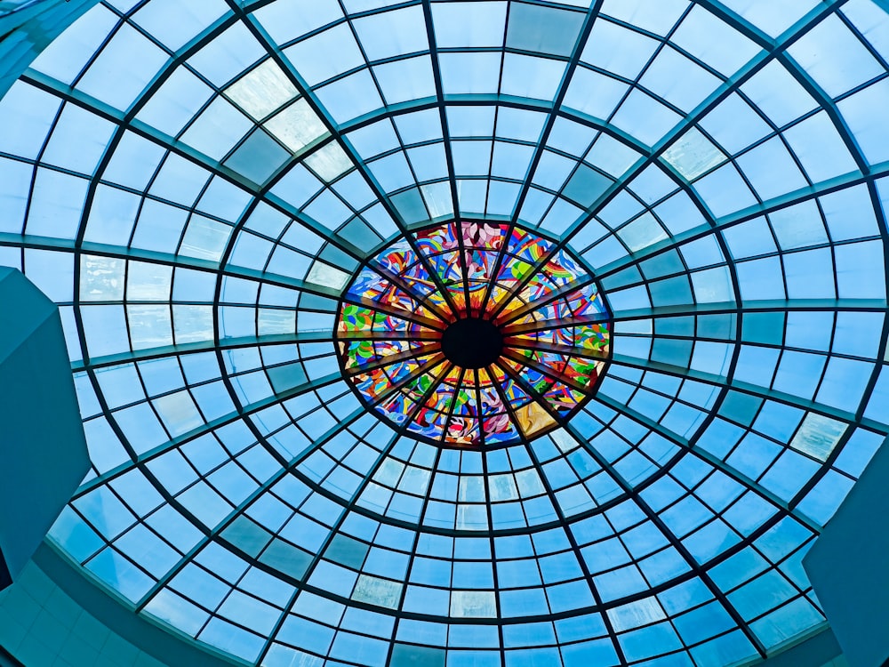 a circular stained glass window in a building