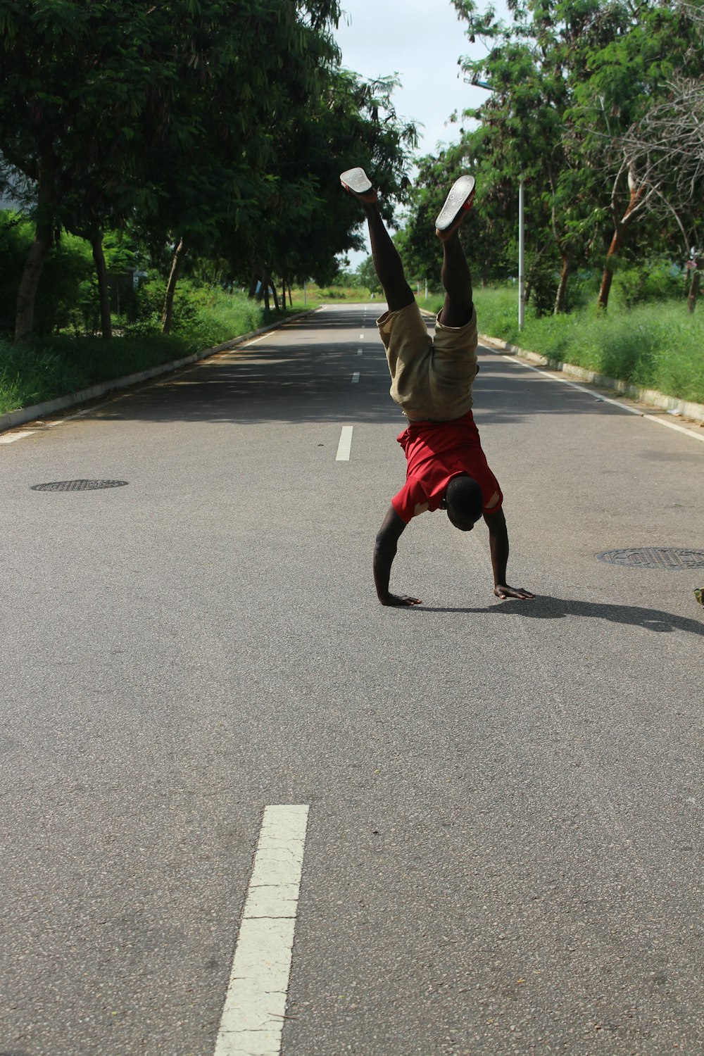 a person jumping in the air to catch a frisbee