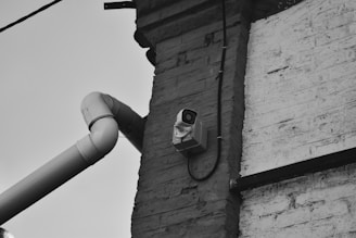 a camera attached to the side of a building