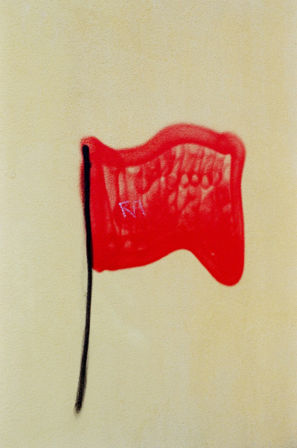 a drawing of a red flag on a white wall