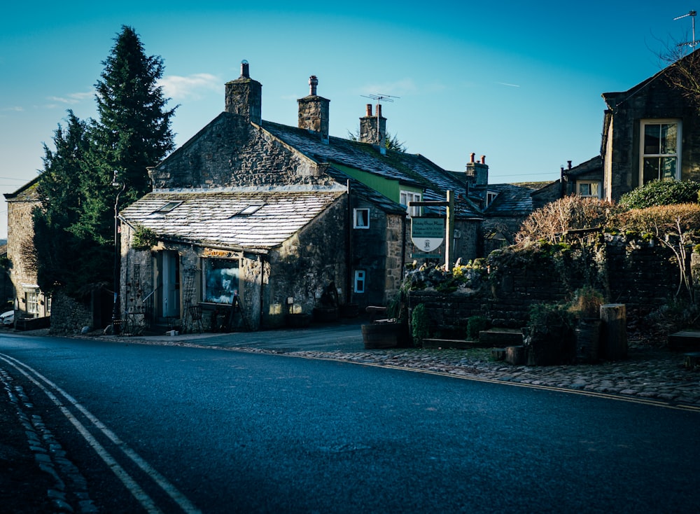 a street lined with stone buildings and trees