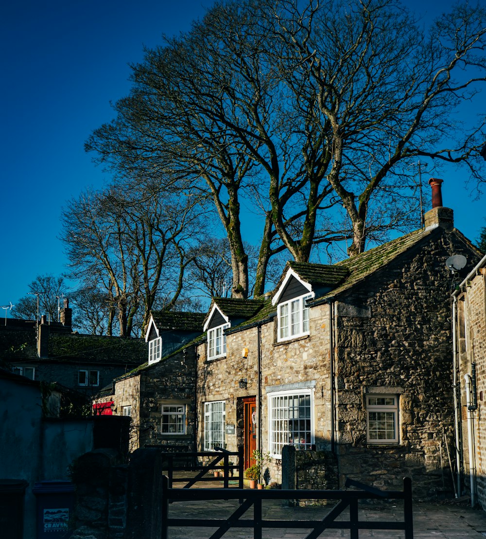 a stone building with a gate in front of it