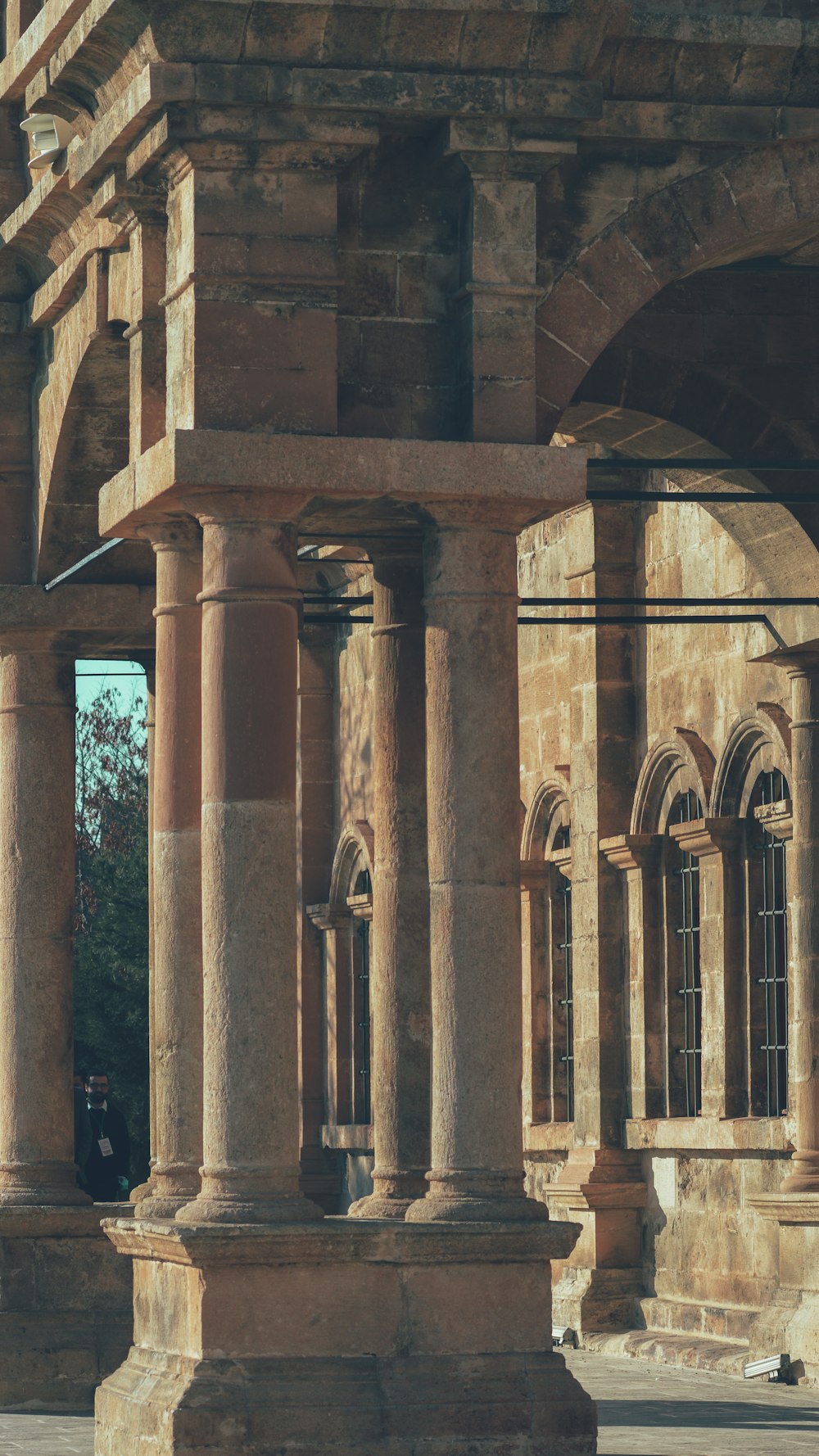 a large stone building with columns and arches