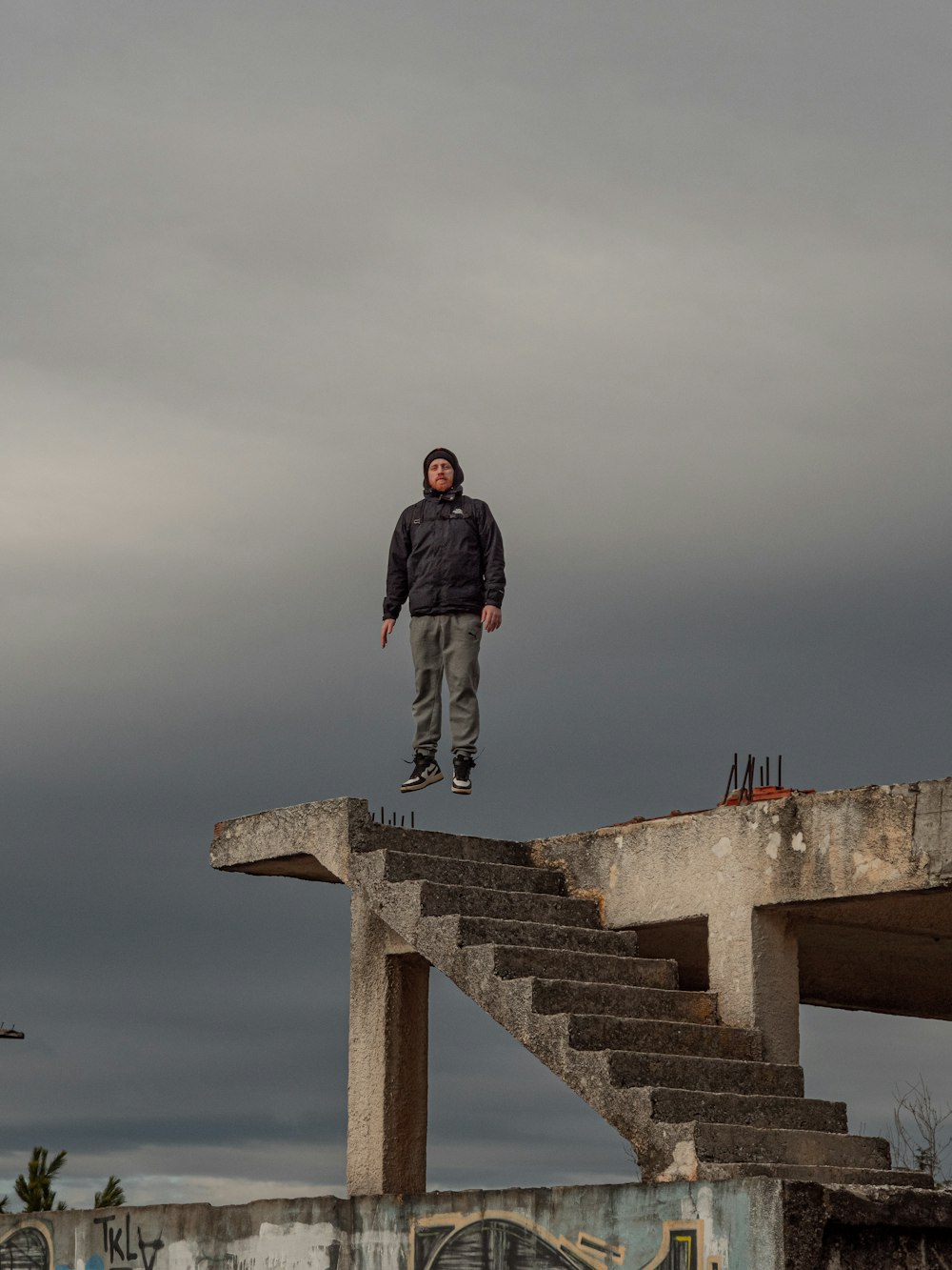 a man standing on top of a set of stairs