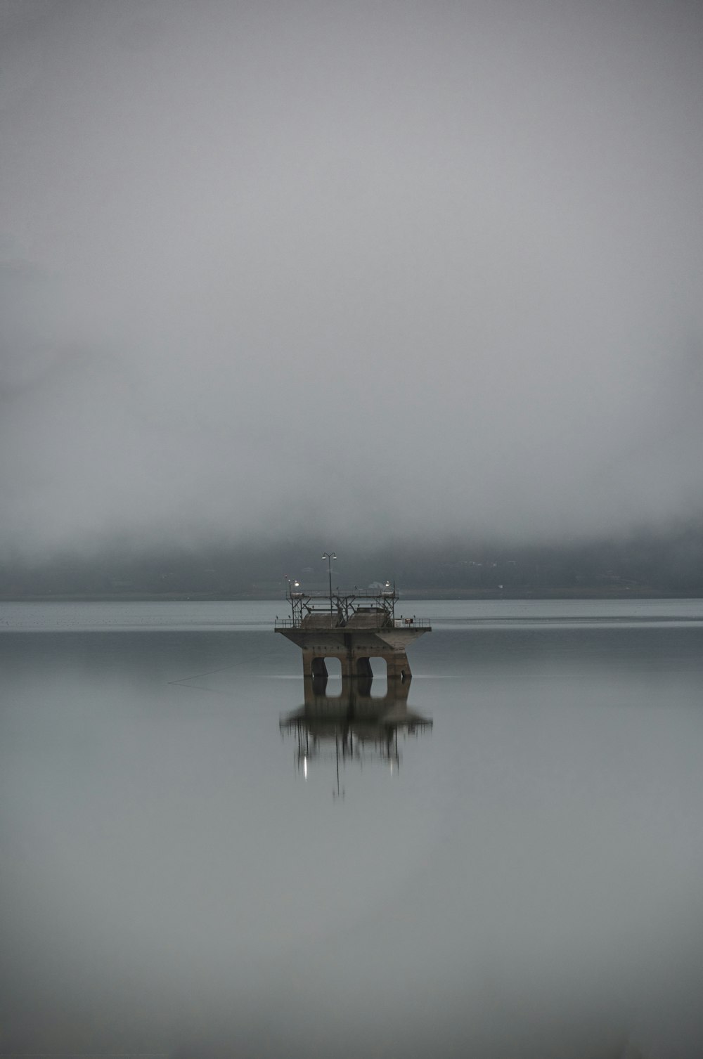 a boat sitting on top of a large body of water