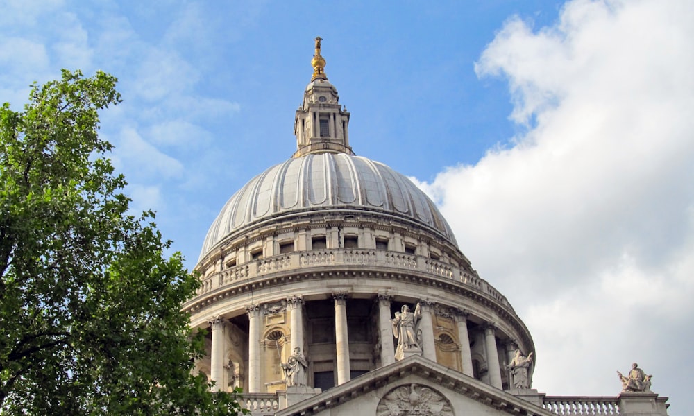 the dome of a building with a clock on it