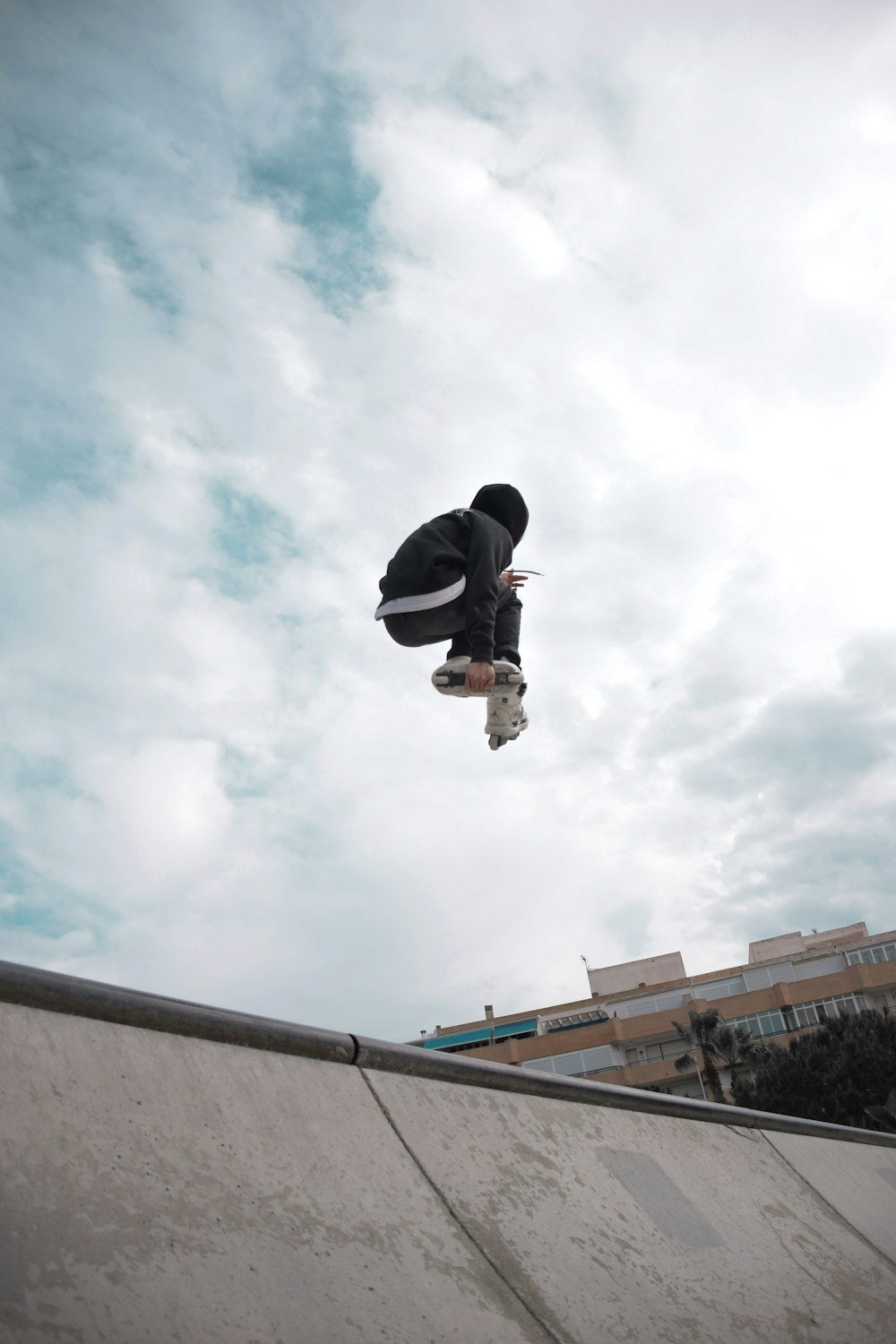 a man flying through the air while riding a skateboard