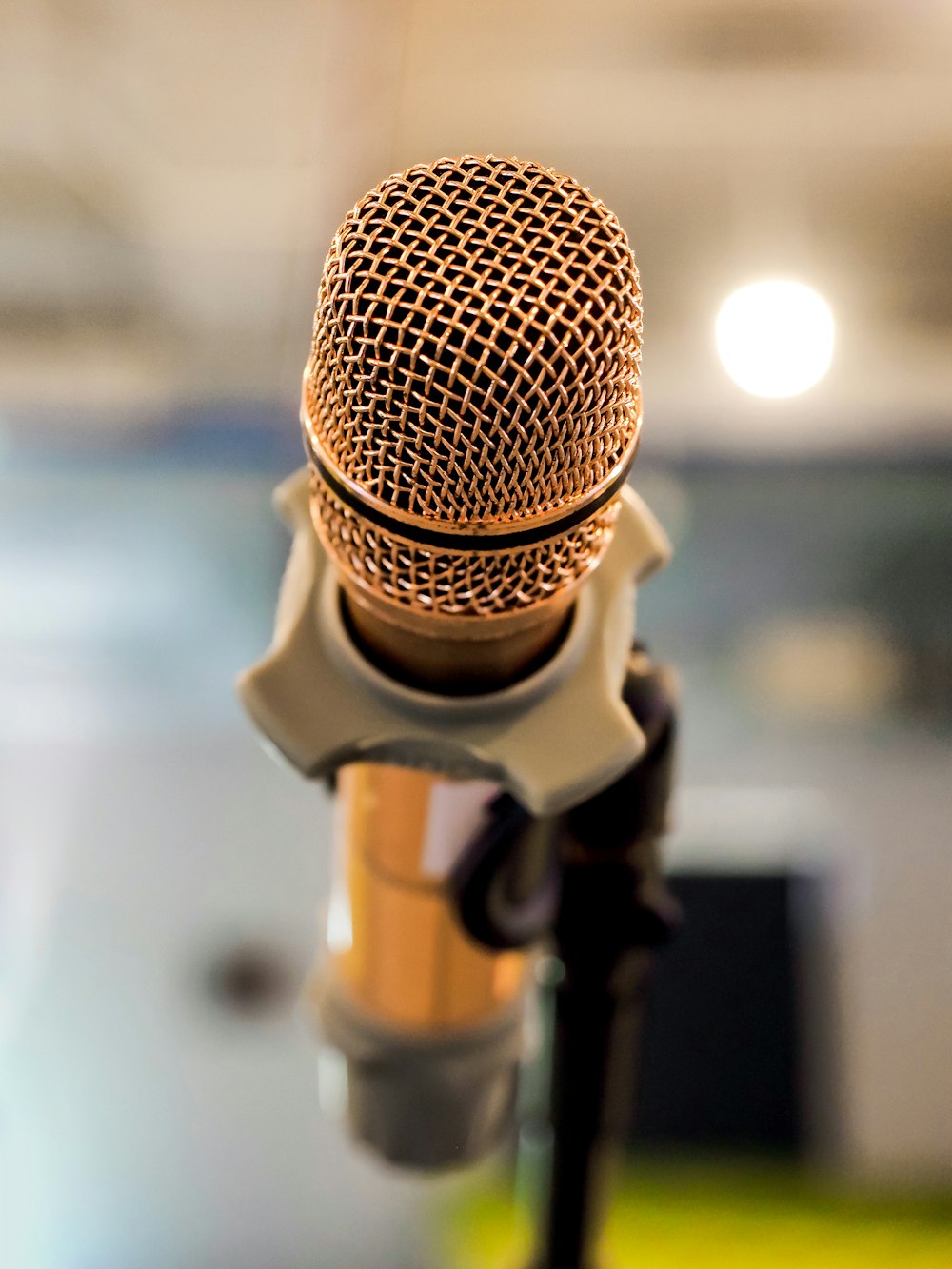 a close up of a microphone with a blurry background