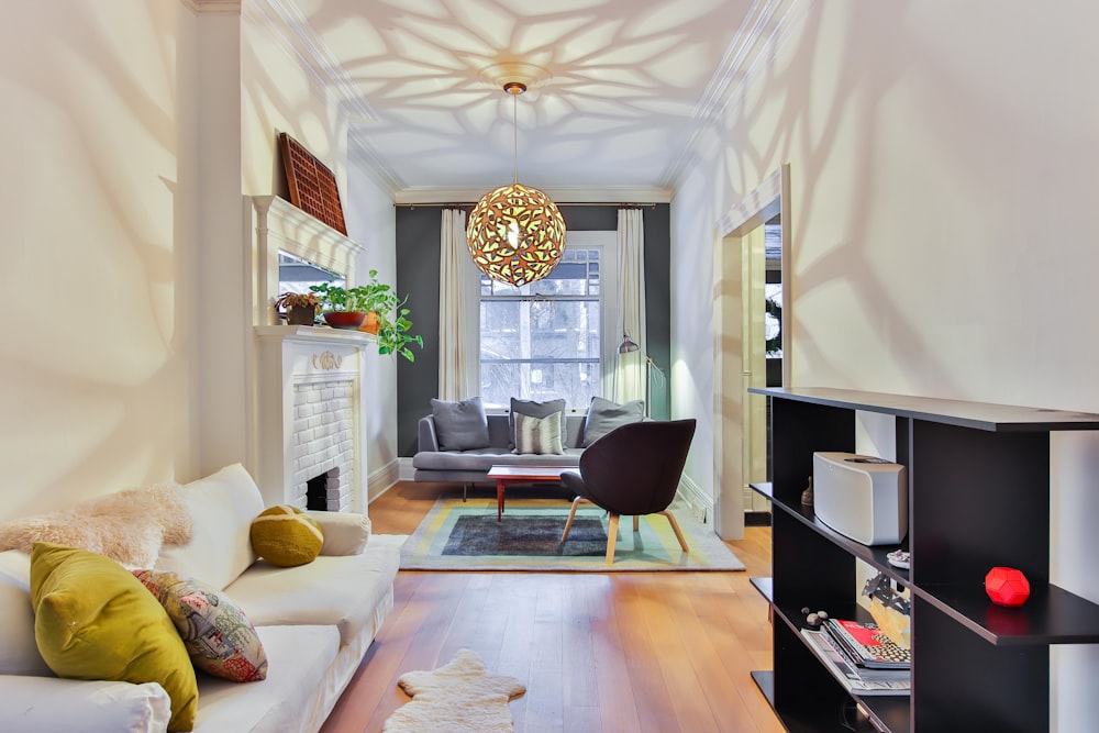 a living room filled with furniture and a fire place