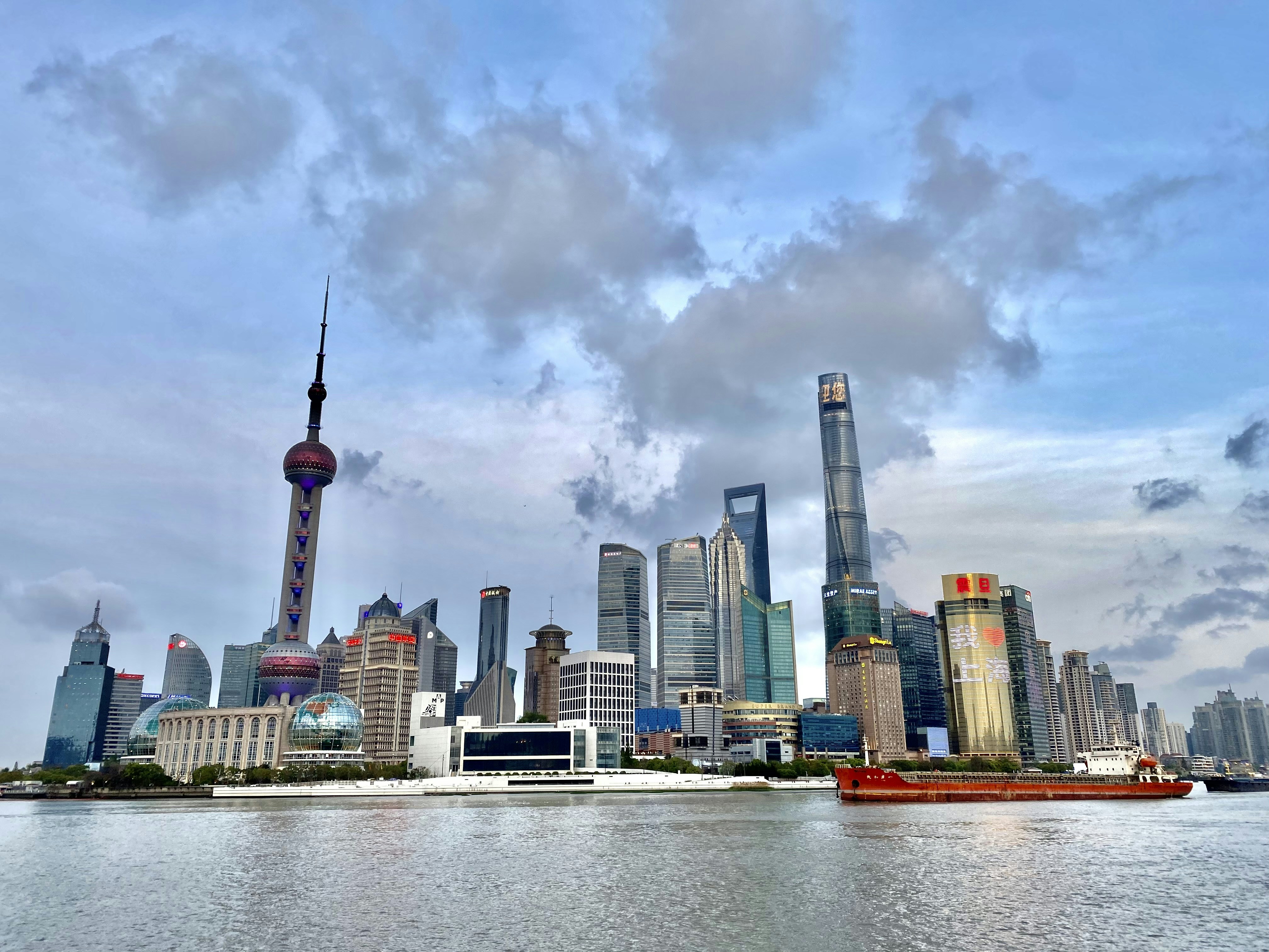 a large body of water with a city in the background