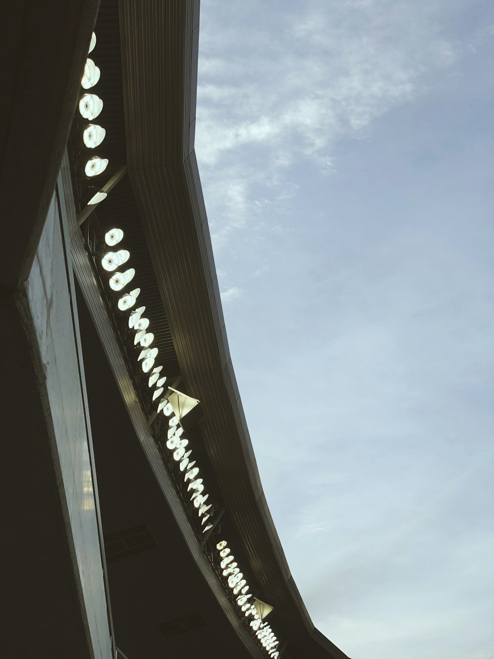 a tall building with a sky in the background