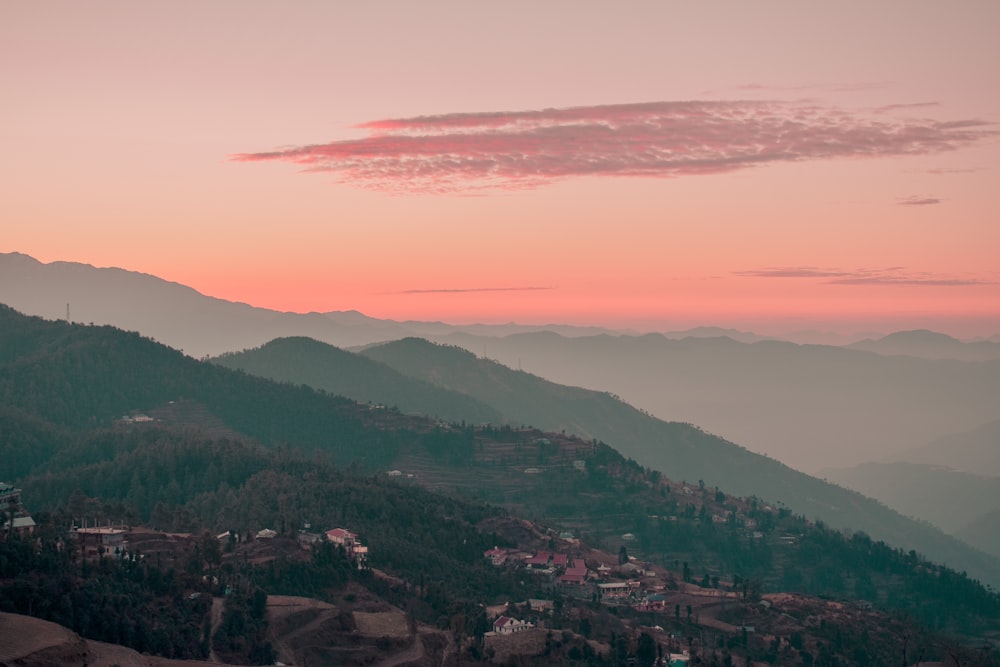 a view of a mountain range at sunset