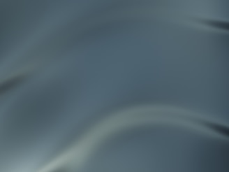 A smooth, gradient background with flowing curves in shades of teal and grey, giving a sense of depth and fluidity.