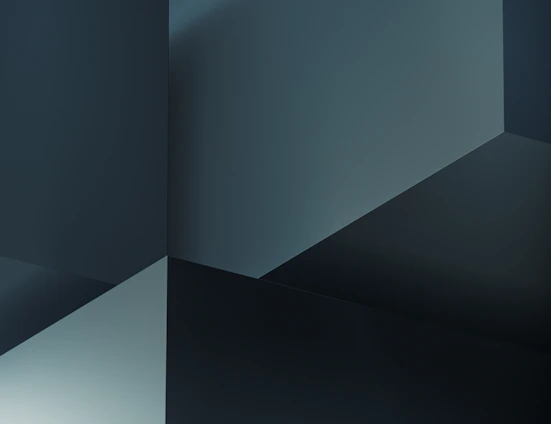Abstract modern geometric shapes in blue and gray tones symbolizing clarity and professionalism.