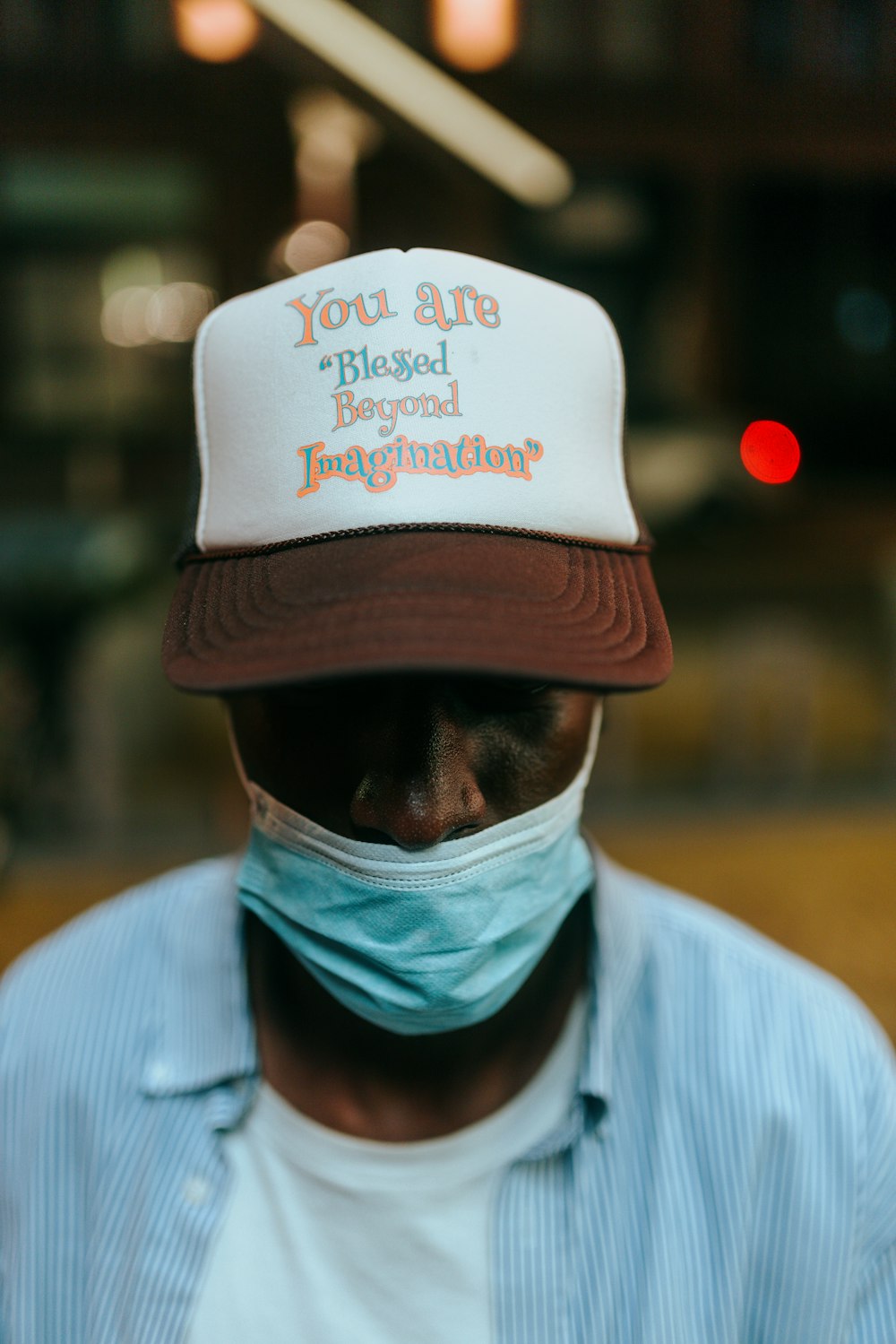 a man wearing a hat and a face mask