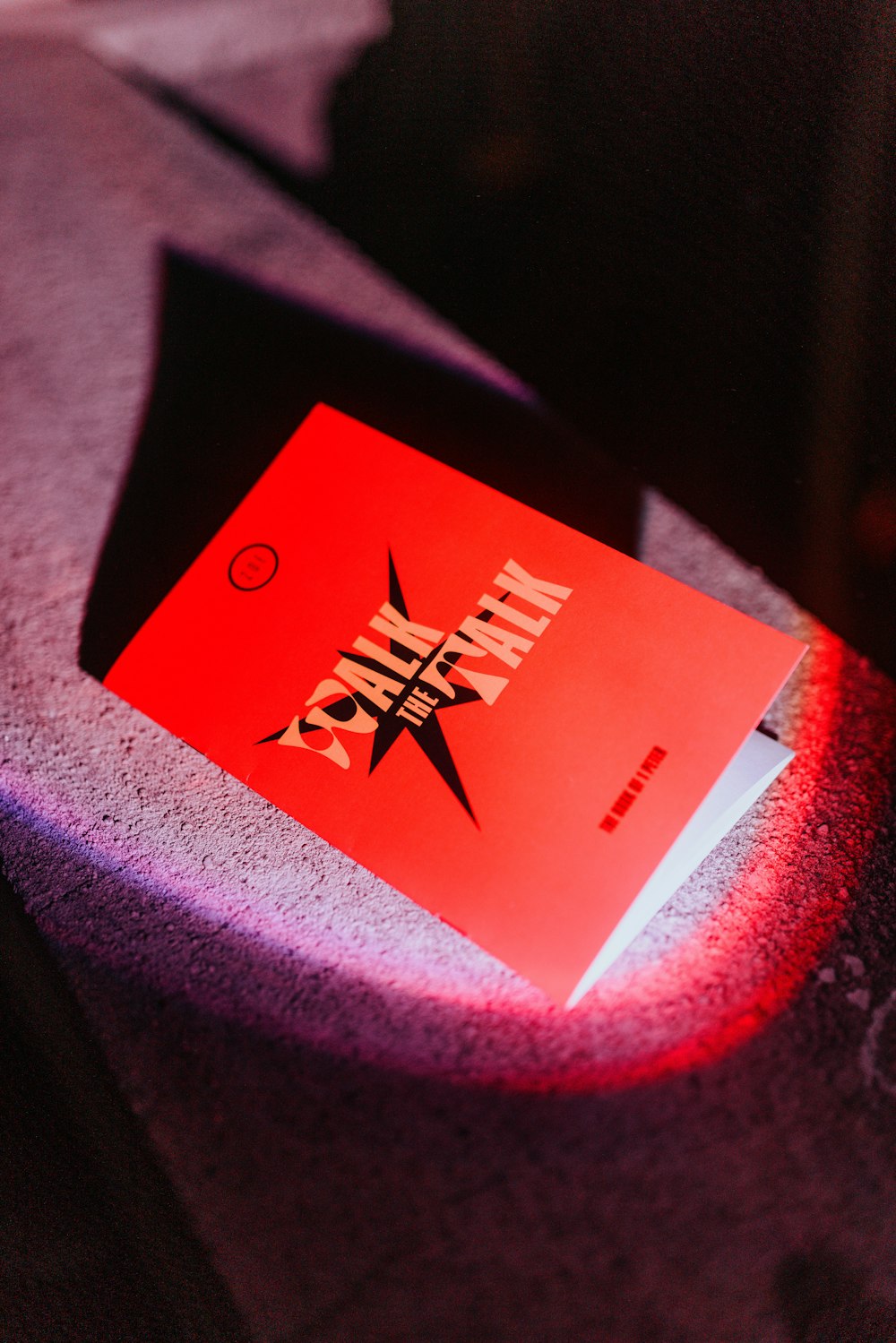 a red book sitting on top of a table