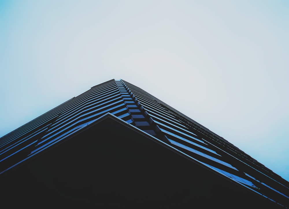 a tall building with a blue sky in the background
