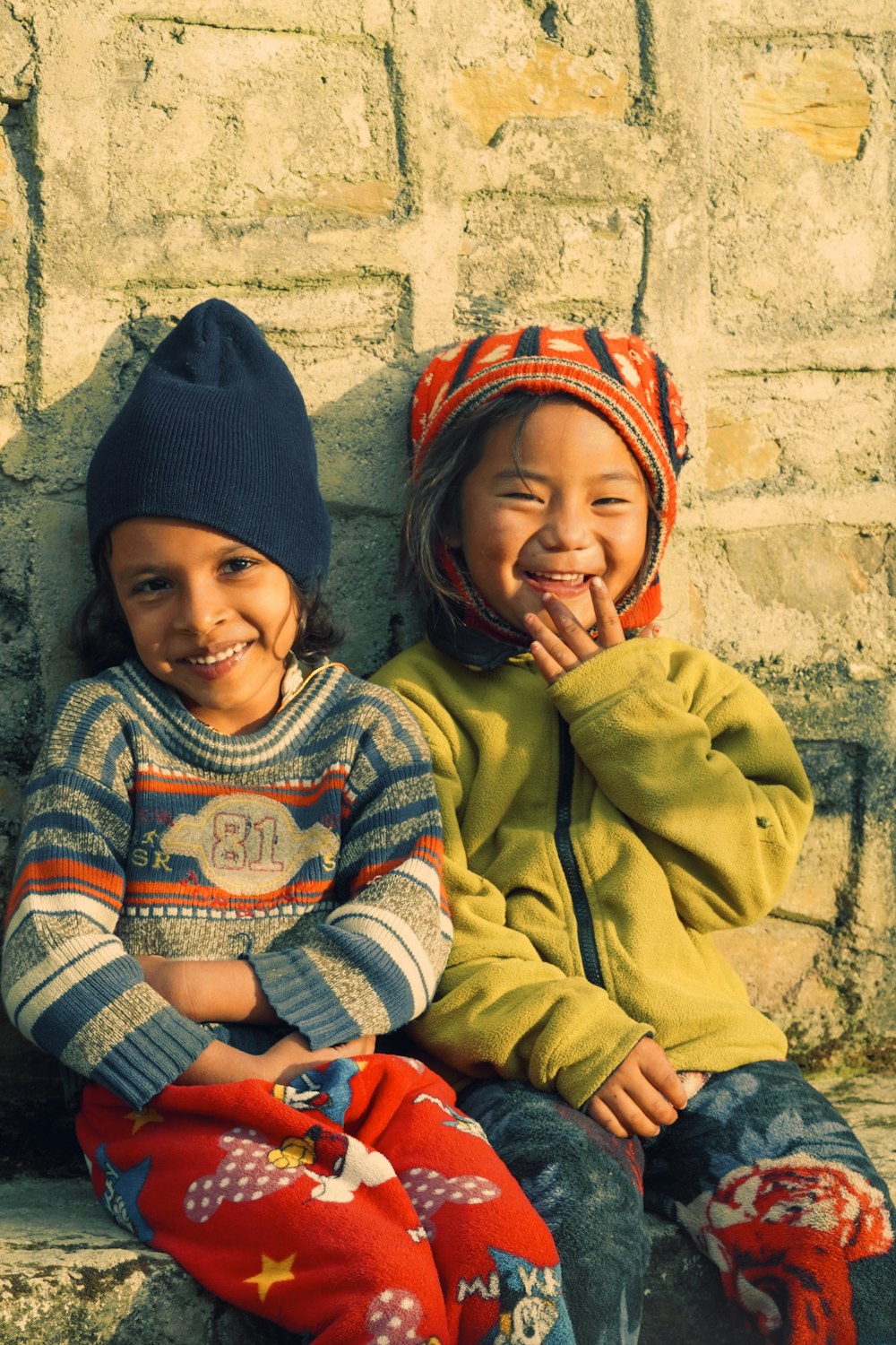 two young children sitting next to each other