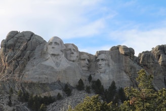 a group of presidents carved into the side of a mountain