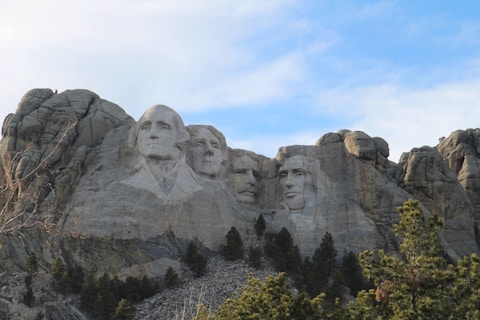 a group of presidents carved into the side of a mountain