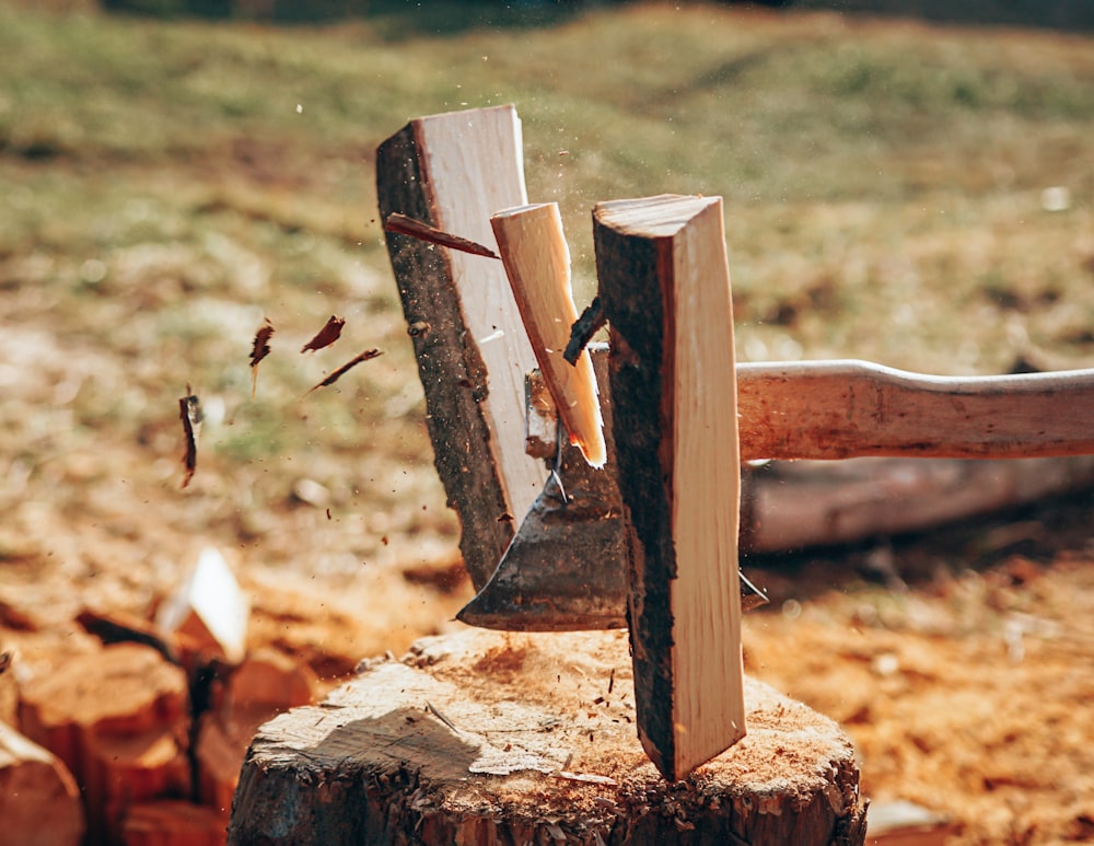 a large axe stuck in a piece of wood