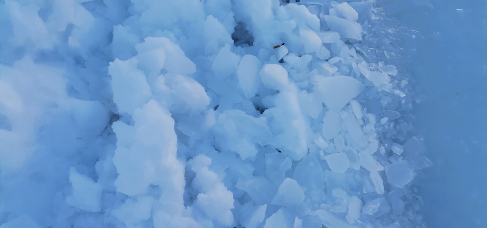 a large amount of ice on the side of a mountain