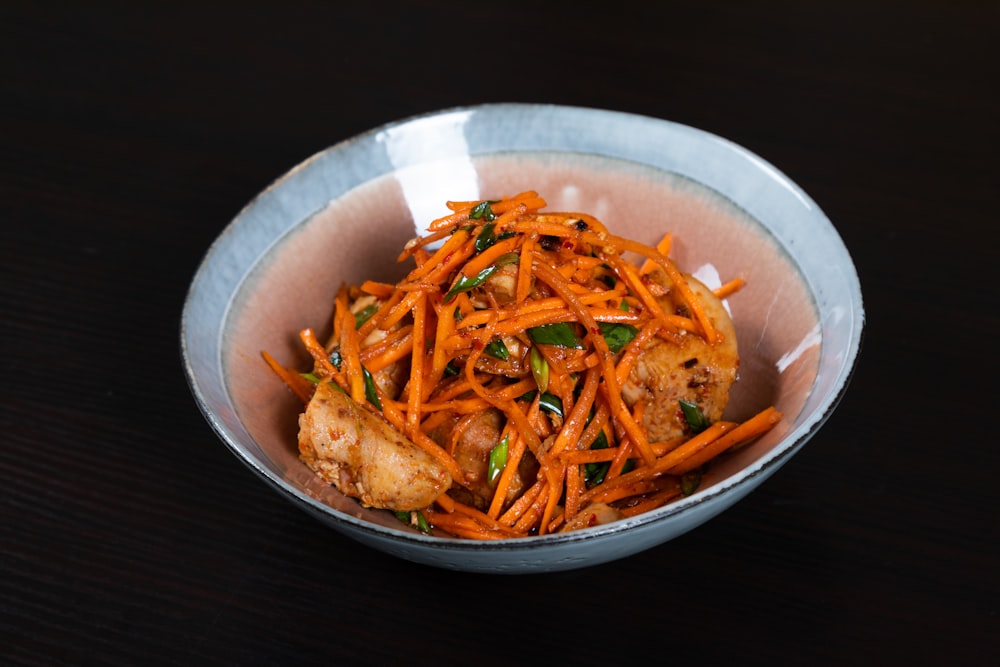 a bowl of food that is on a table