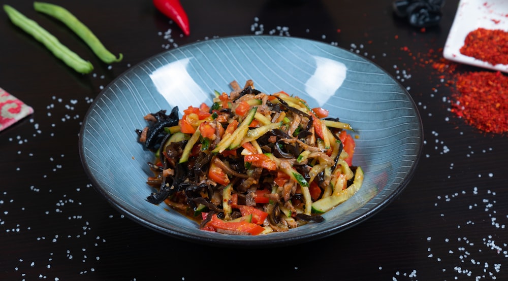 a plate of stir fried vegetables on a table