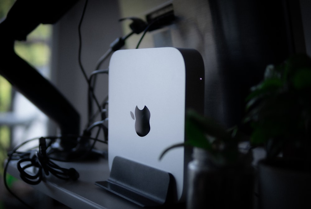 an apple computer sitting on top of a desk