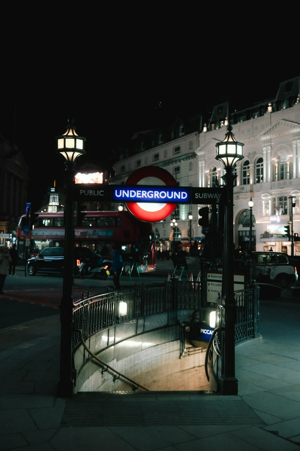 a street scene with focus on the underground sign