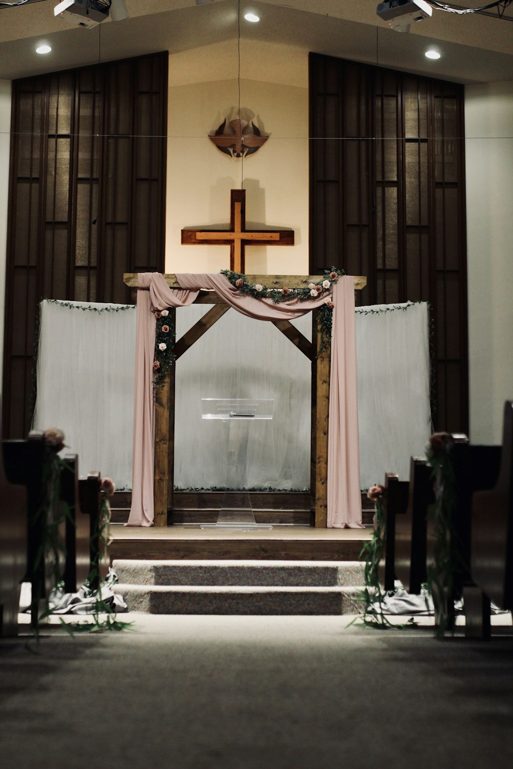 a church with a cross on the alter