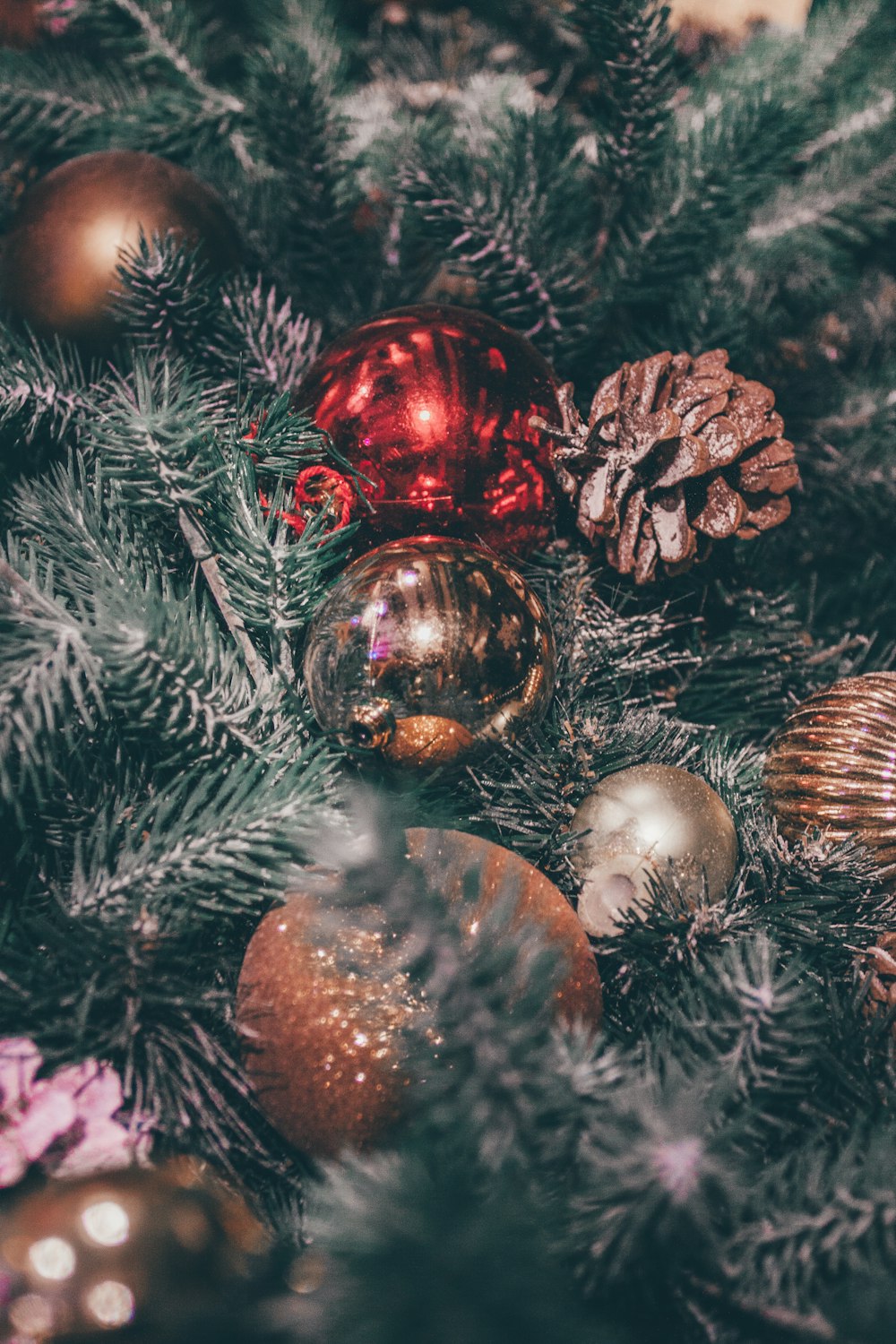 a close up of a christmas tree with ornaments