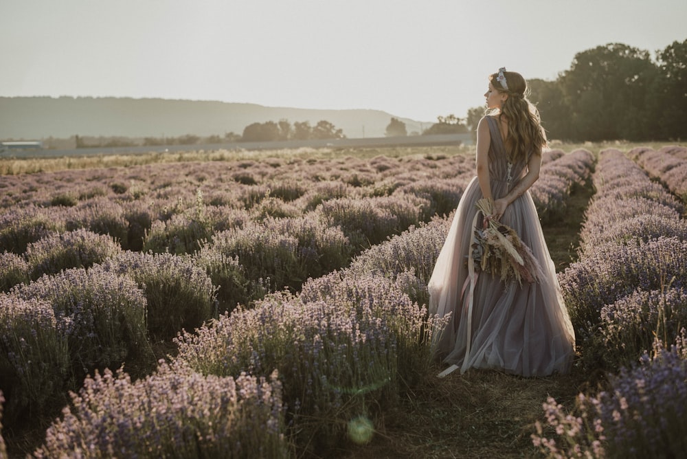 a person standing on a grass covered field