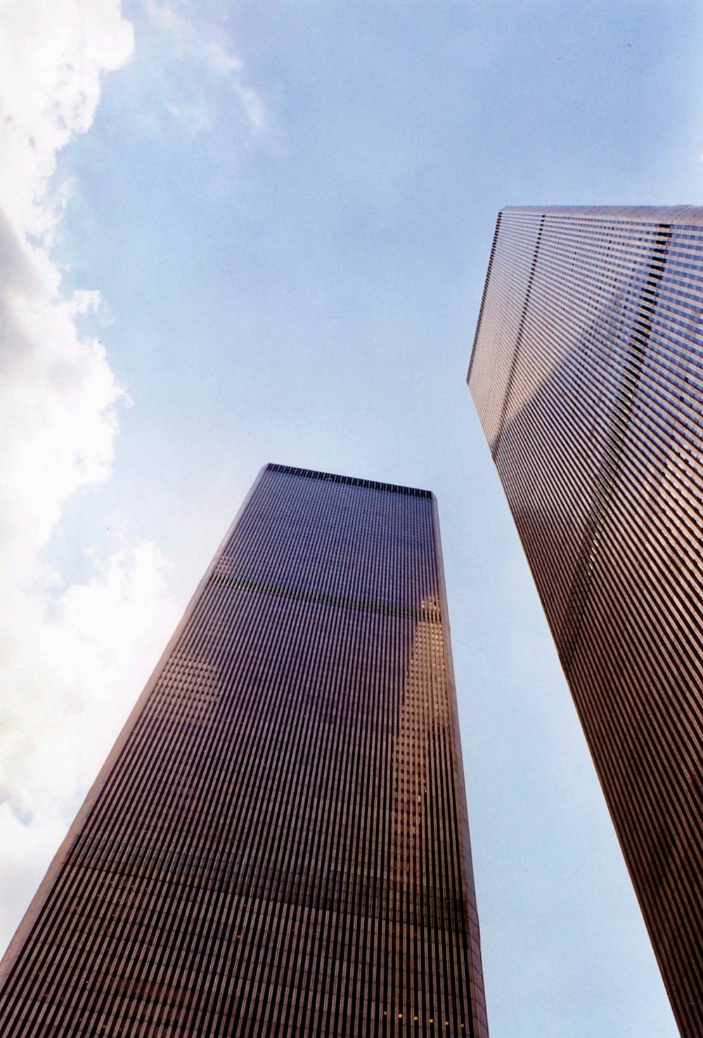 a couple of tall buildings sitting next to each other