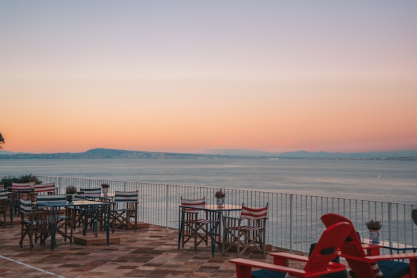 Outdoor terrace with charming views of the quaint Oudendijk village at sunset.