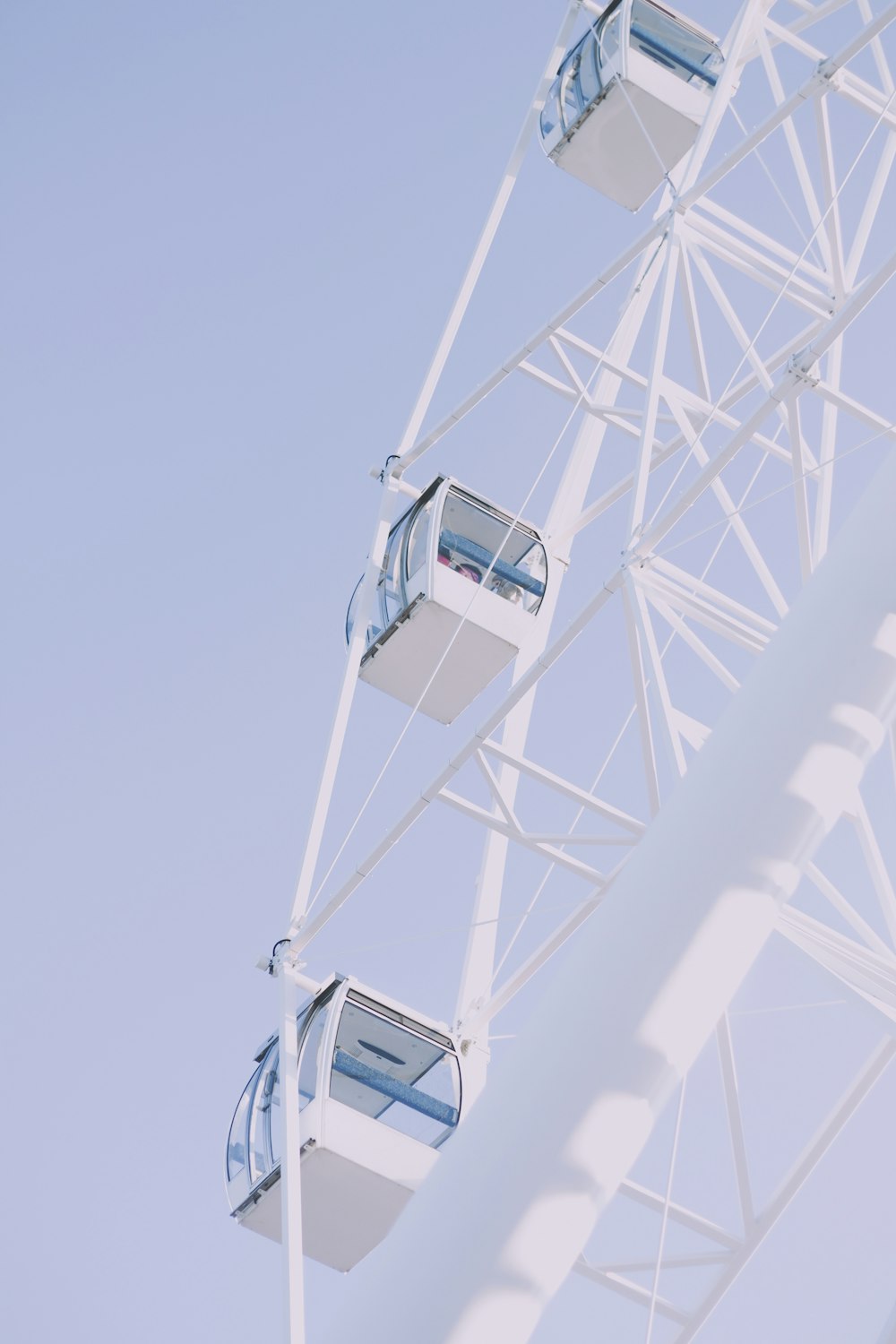 a ferris wheel is shown against a blue sky