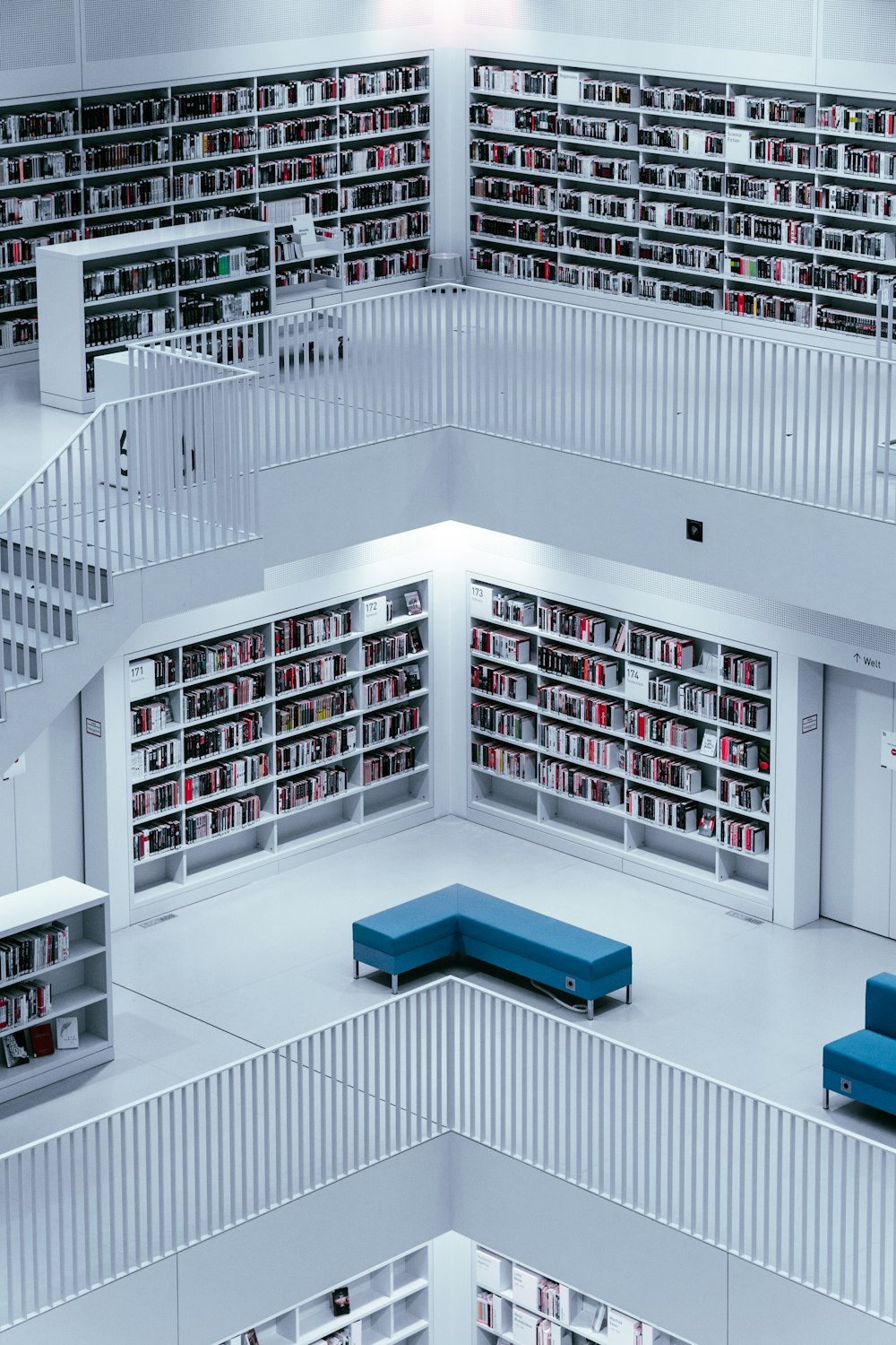 a room filled with lots of shelves filled with books