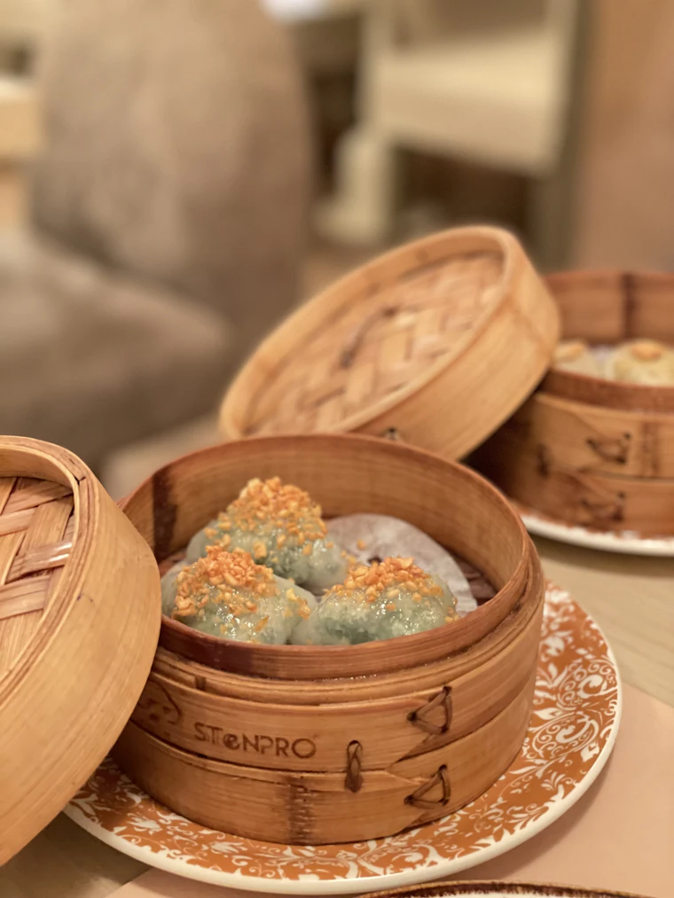 Assorted dim sum in bamboo baskets