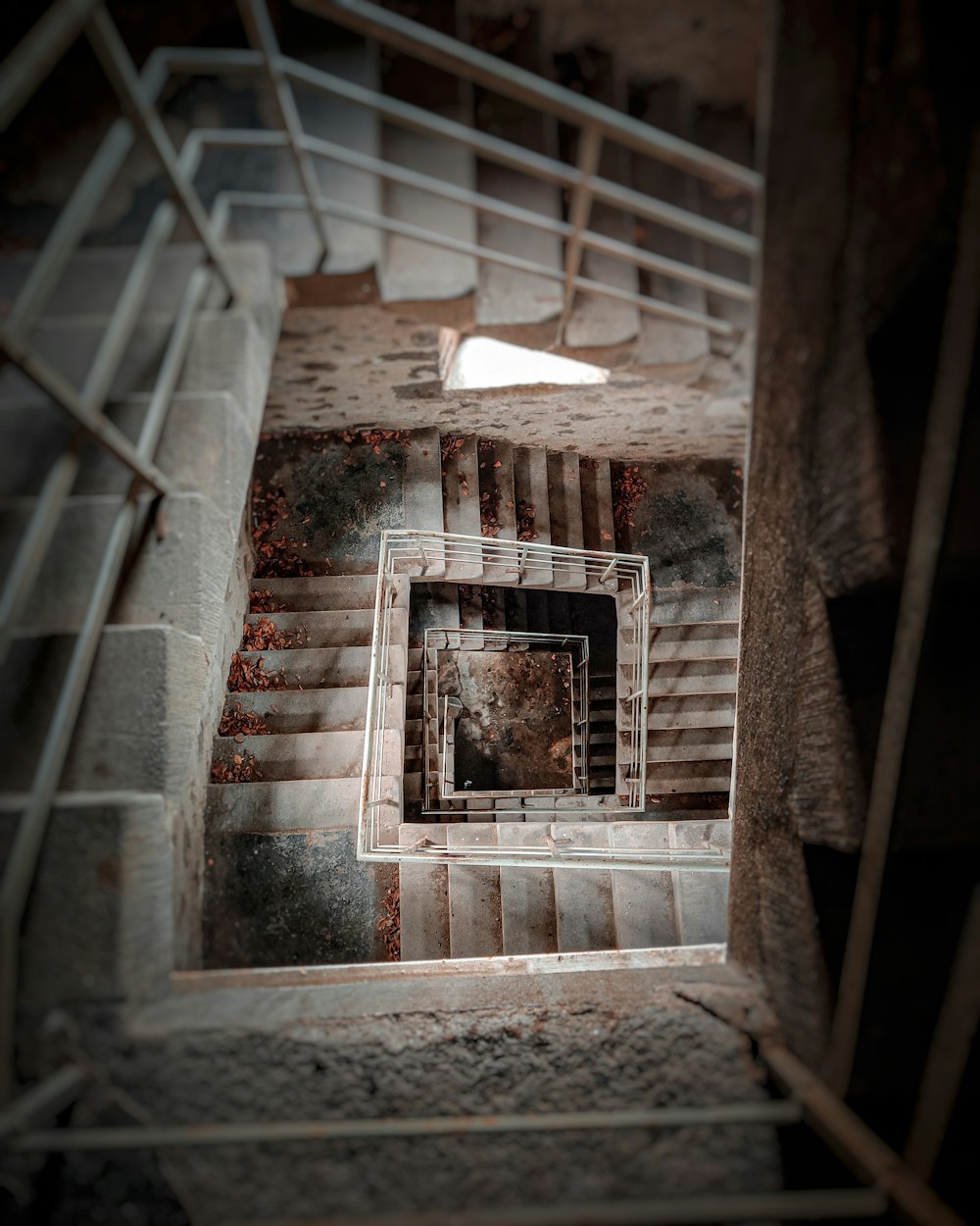 a staircase with a hole in the middle of it