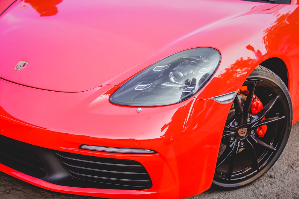 a red sports car parked in a parking lot