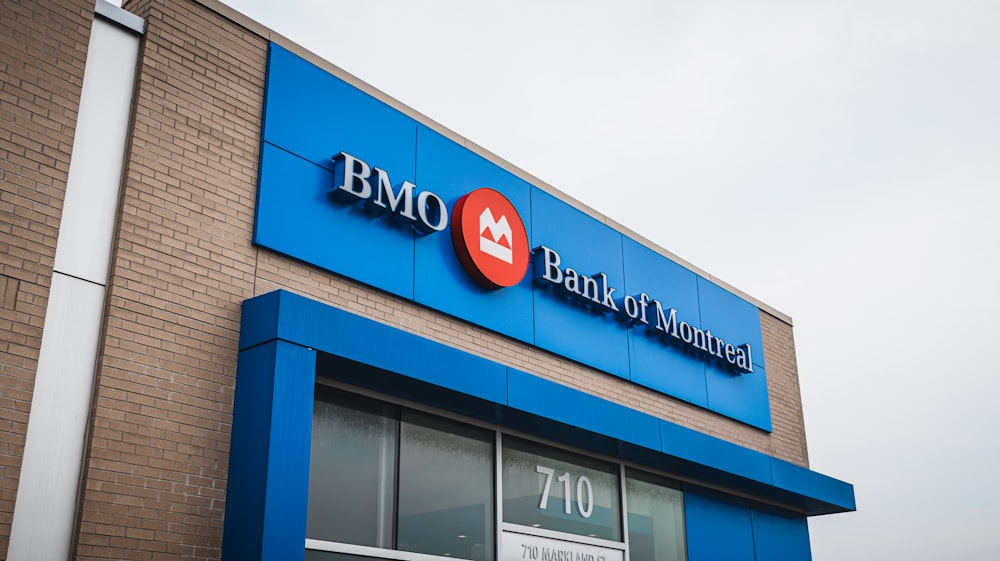 a bmo store front with a red and blue sign