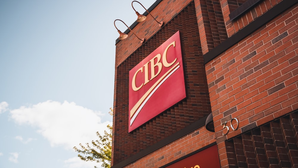 a close up of a brick building with a sign on it