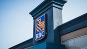 a blue and yellow sign on the side of a building