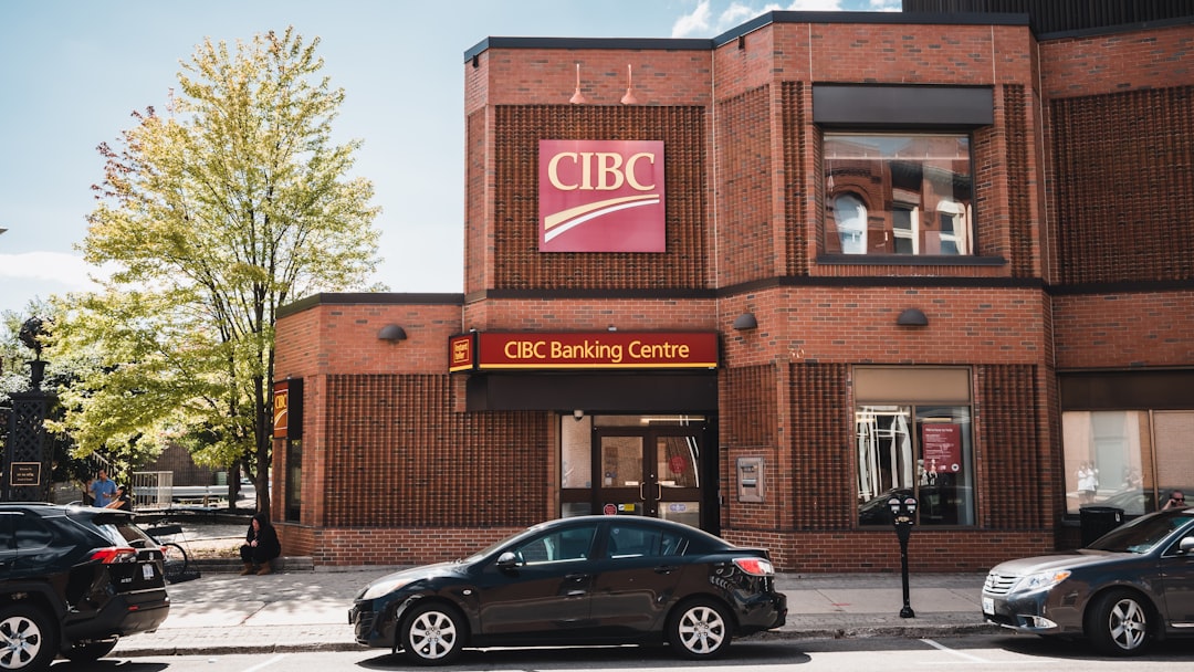 a group of cars parked in front of a building, CIBC Banking Centre