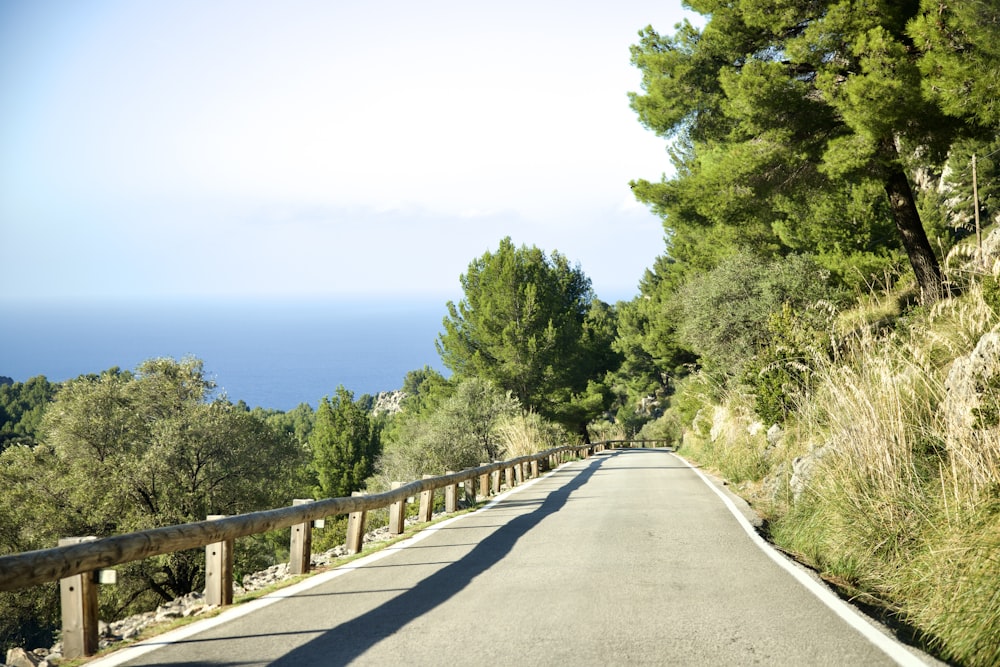 a person riding a skateboard down a road