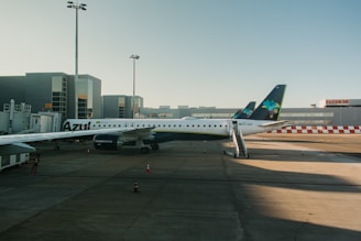 a large jetliner sitting on top of an airport tarmac