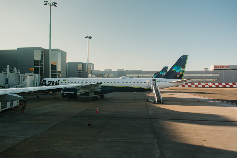 a large jetliner sitting on top of an airport tarmac