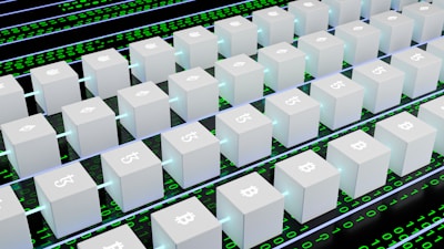 A digital artwork featuring multiple white cubic blocks aligned in a grid pattern, each displaying symbols of various cryptocurrencies like Bitcoin and Ethereum. The blocks are interconnected by glowing lines, set against a background of binary code in green and black.