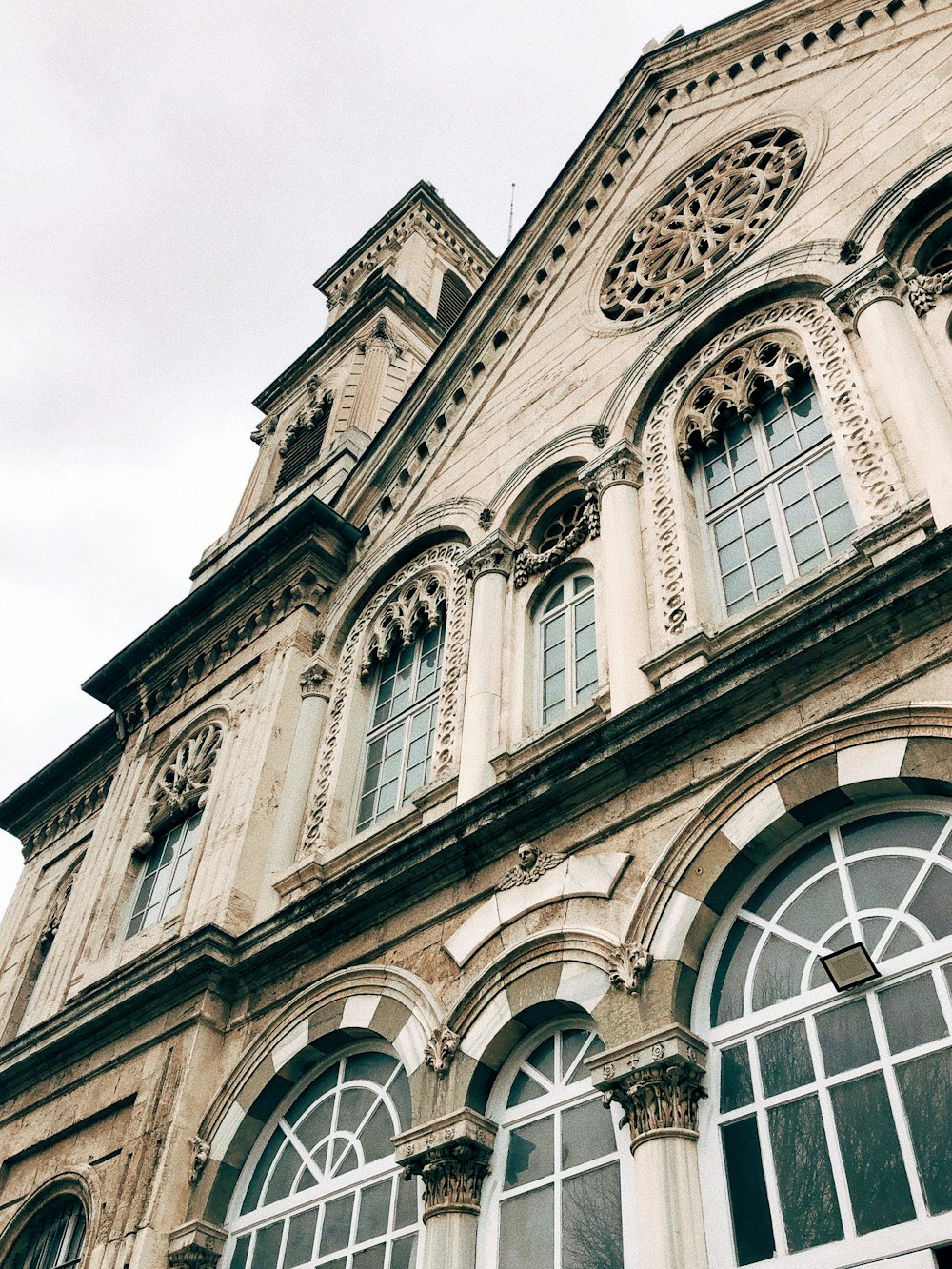 a tall building with a clock on the front of it