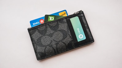 a wallet with credit cards sticking out of it